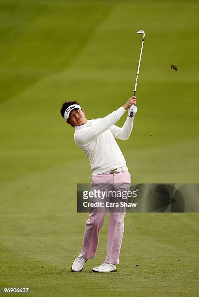 Ryuji Imada of Japan hits his approach shot on the first hole during the first round of the AT&T Pebble Beach National Pro-Am at at the Spyglass Hill...