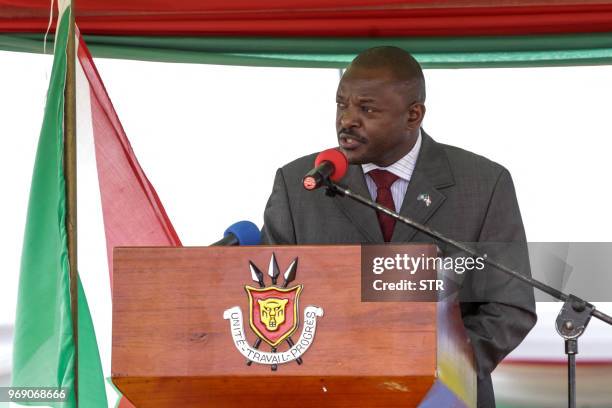 Burundi's President Pierre Nkurunziza addresses the gathering after signing for a new constitution adopted by a referendum in Bugendana, Burundi, on...