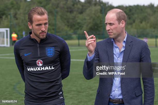 Prince William, Duke of Cambridge chats to Harry Kane as he attends the Facility at the FA Training Ground to meet members of the England Squad...