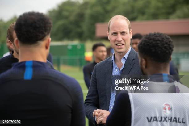 Prince William, Duke of Cambridge chats to England players as he attends the Facility at the FA Training Ground to meet members of the England Squad...