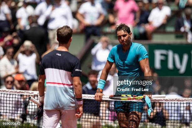 Diego Schwartzman of Argentina congratulates Rafael Nadal of Spain on victory following their mens singles quarter finals match during day twelve of...