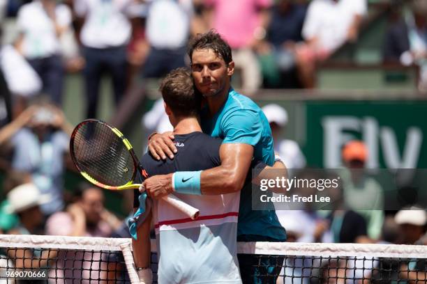 Diego Schwartzman of Argentina congratulates Rafael Nadal of Spain on victory following their mens singles quarter finals match during day twelve of...