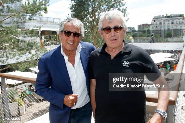 Actors Richard Anconina and Michel Boujenah attend the 2018 French Open - Day Twelve at Roland Garros on June 7, 2018 in Paris, France.