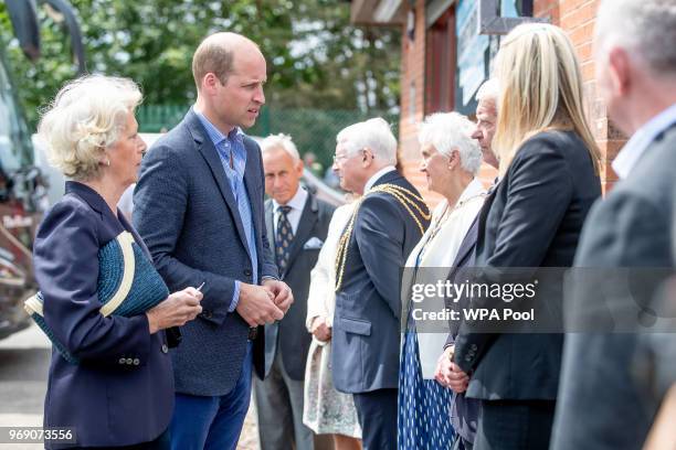 Prince William, Duke of Cambridge chats to the Lord Lieutenant and local dignitaries as he attends the Facility at the FA Training Ground to meet...