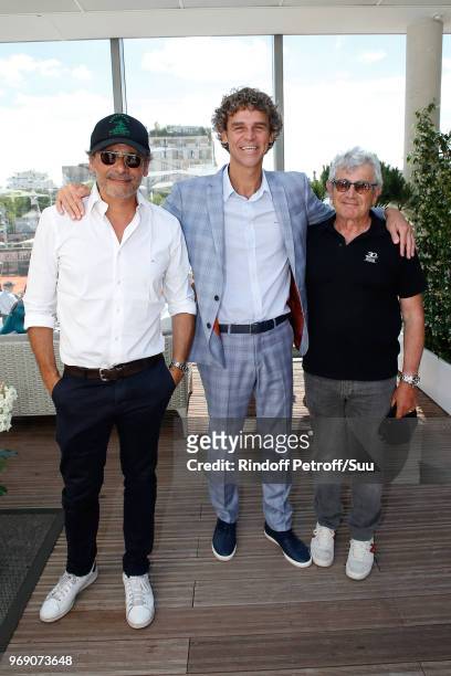 Tennis player Gustavo Kuerten standing between Pascal Elbe and Michel Boujenah attend the 2018 French Open - Day Twelve at Roland Garros on June 7,...