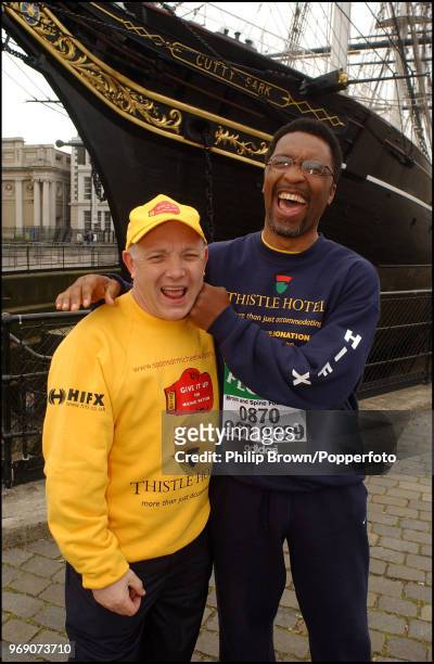 Former middleweight boxer Michael Watson with boxing promoter and manager Frank Maloney in front of the Cutty Sark during Michael Watson's London...