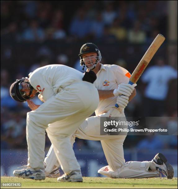 Steve Waugh of Australia hits the ball past John Crawley of England during his innings of 102 runs in the 5th Test match between Australia and...