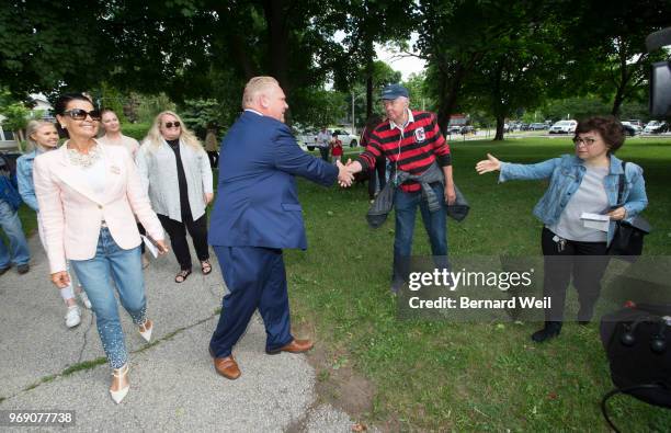 Ontario PC Leader Doug Ford walks with his wife Karla and family to St. George's Junior School Polling Station 28 in Etobicoke to cast his vote in...