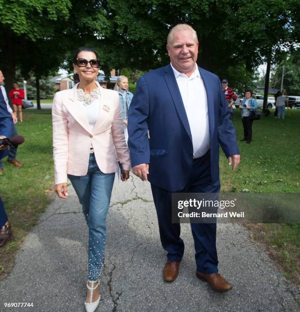 Ontario PC Leader Doug Ford walks with his wife Karla and family to St. George's Junior School Polling Station 28 in Etobicoke to cast his vote in...