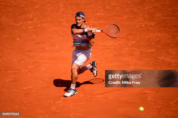 Diego Schwartzman of Argentina hits a forehand to Rafael Nadal of Spain in the quarter finals of the men's singles at Roland Garros during the French...