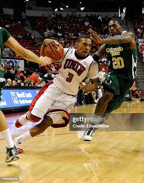 Anthony Marshall of the UNLV Rebels drives against Harvey Perry of the Colorado State Rams during their game at the Thomas & Mack Center February 20,...