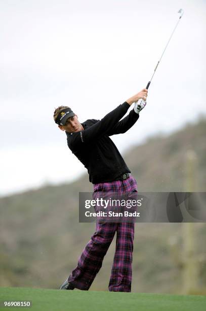 Ian Poulter of England hits to the eighth green during round four of the World Golf Championships-Accenture Match Play Championship at The...