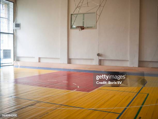 indoors basketball court filled with natural light - 体育館 ストックフォトと画像