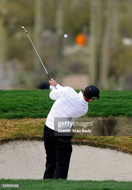 Paul Casey of England hits to the 14th green during round four of the World Golf Championships-Accenture Match Play Championship at The Ritz-Carlton...