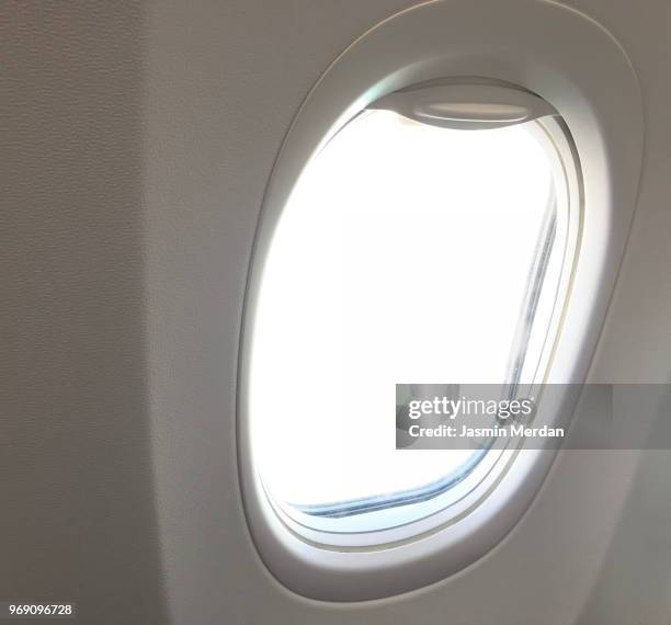 airplane window - jasmin merdan stock-fotos und bilder