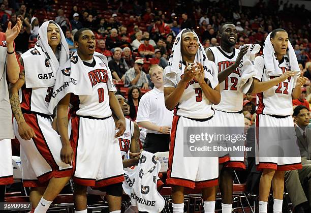 Tre'Von Willis, Oscar Bellfield, Anthony Marshall, Brice Massamba and Chace Stanback of the UNLV Rebels celebrate on the bench late in their 70-39...