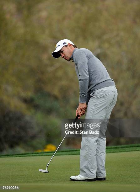 Camilo Villegas of Colombia hits his putt at the17th green during round four of the World Golf Championships-Accenture Match Play Championship at The...