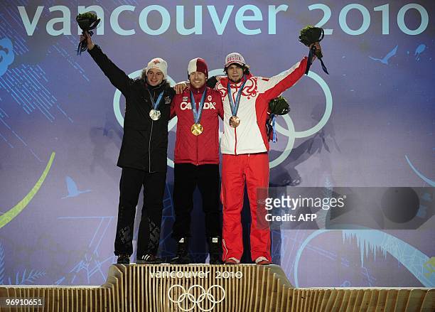 Latvia's silver medalist Martins Dukurs, Canada's gold medalist Jon Montgomery and Russia's bronze medalist Alexander Tretyakov celebrate on the...
