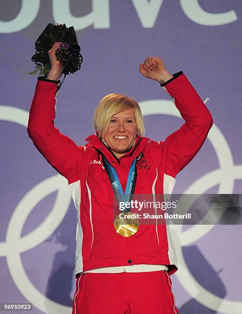 Andrea Fischbacher of Austria receives the gold medal during the medal ceremony for the women's super-g alpine skiing held at the Whistler Medals...