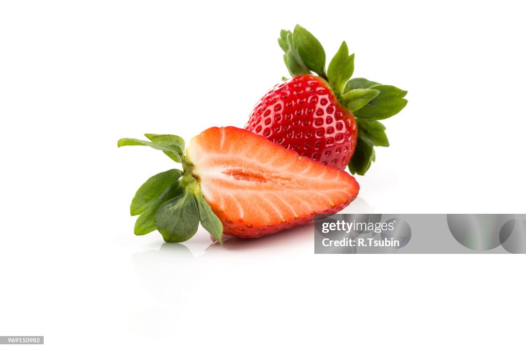 Red ripe strawberry fruits on a dark background