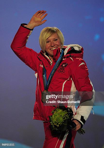 Andrea Fischbacher of Austria receives the gold medal during the medal ceremony for the women's super-g alpine skiing held at the Whistler Medals...