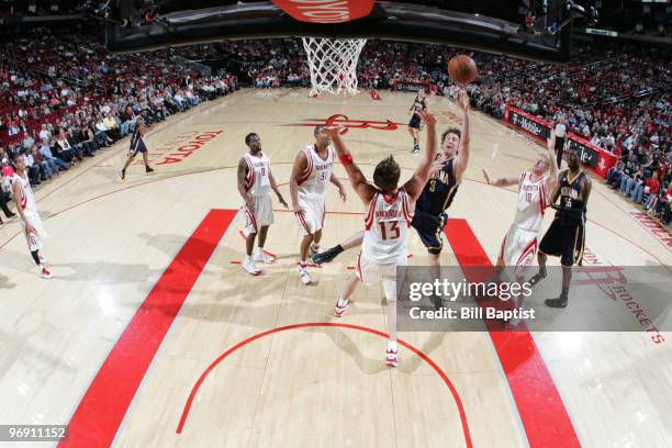 Troy Murphy of the Indiana Pacers shoots the ball over David Anderson of the Houston Rockets on February 20, 2010 at the Toyota Center in Houston,...