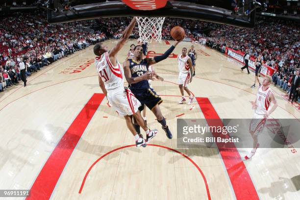 Danny Granger of the Indiana Pacers shoots the ball over Shane Battier of the Houston Rockets on February 20, 2010 at the Toyota Center in Houston,...
