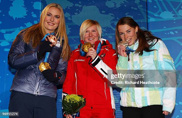 Lindsey Vonn of the United States receives the bronze medal, Andrea Fischbacher of Austria receives the gold medal and Tina Maze of Slovenia receives...