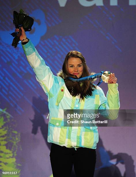 Tina Maze of Slovenia receives the silver medal during the medal ceremony for the women's super-g alpine skiing held at the Whistler Medals Plaza on...