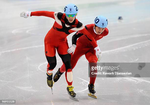 Francois Hamelin of Canada competes with Liang Wenhao of China during the Short Track Speed Skating Men's 1000 m quarterfinal on day 9 of the...