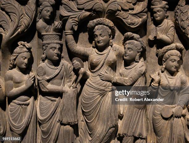 Carved stone sculpture from the Kushan dynasty depicts the birth of the Buddha. According to Buddhist mythology, the Buddha was born as his mother,...