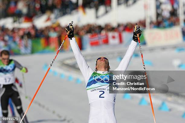 Marcus Hellner of Sweden celebrates his victory over Tobias Angerer of Germany during the men's 30km pursuit at the Olympic Winter Games Vancouver...