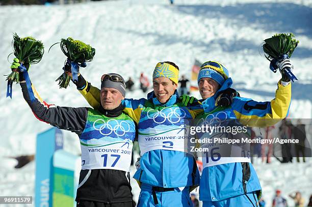 Marcus Hellner of Sweden takes the Gold Medal, Tobias Angerer of Germany takes the Silver Medal, Johan Olsson of Sweden takes the Bronze Medal during...