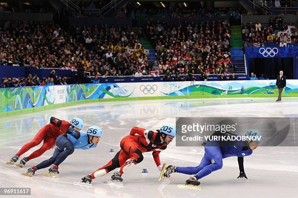 LtoR, China's Jialiang Han, US Apolo Anton Ohno, Canada's Charles Hamelin and South Korea's Si-Bak Sung compete in the Men's 1000m short-track...