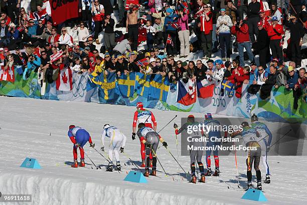 Czech Lucas Bauer leads Dario Cologna of Switzerland, Johan Olsson of Sweden, Tobias Angerer of Germany, Jens Filbrich of Germany, Alexander Legkov...