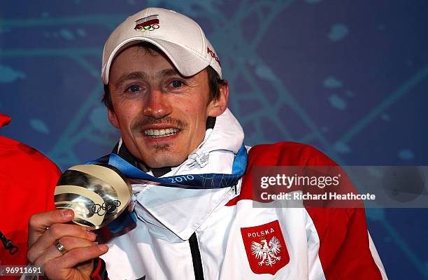 Adam Malysz of Poland receives the silver medal during the medal ceremony for the men's large hill individual ski jumping held at the Whistler Medals...