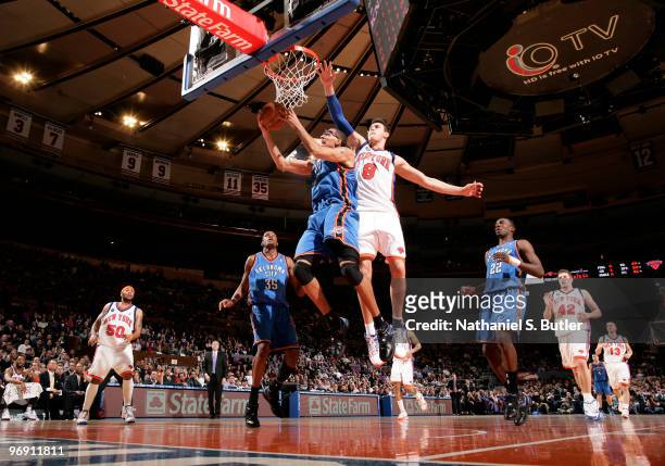 Thabo Sefolosha of the Oklahoma City Thunder shoots against Danilo Gallinari of the New York Knicks on February 20, 2010 at Madison Square Garden in...