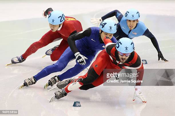 Charles Hamelin of Canada leads Sung Si-Bak of South Korea, Han Jialiang of China and Apolo Anton Ohno of the United States during the Short Track...