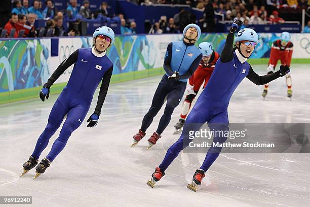 Lee Jung-Su of South Korea celebrates winning the gold medal from silver medalist Lee Ho-Suk of South Korea and bronze medalist Apolo Anton Ohno of...