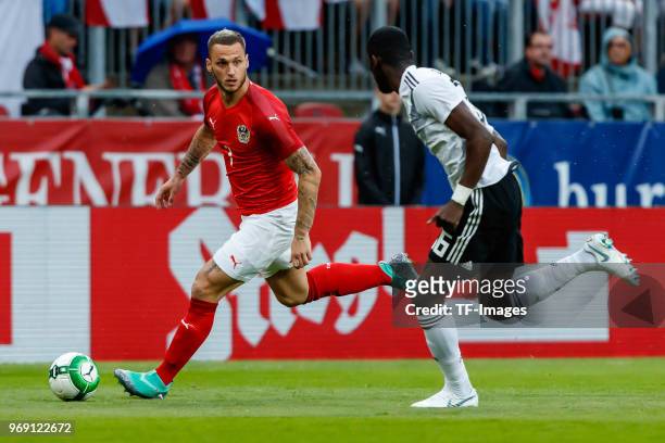 Marko Arnautovic of Austria and Antonio Ruediger of Germany battle for the ball during the international friendly match between Austria and Germany...