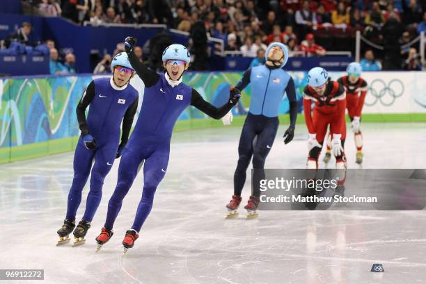 Lee Jung-Su of South Korea celebrates winning the gold medal from silver medalist Lee Ho-Suk of South Korea and bronze medalist Apolo Anton Ohno of...