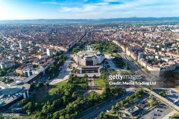 brede luchtfoto drone schot van nationale paleis van cultuur in sofia downtown district van de stad - bulgarije stockfoto's en -beelden