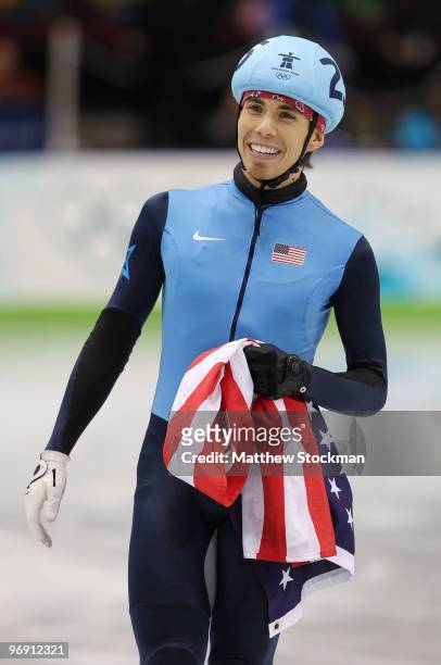 Apolo Anton Ohno of the United States celebrates after winning bronze during the Short Track Speed Skating Men's 1000m Final on day 9 of the...
