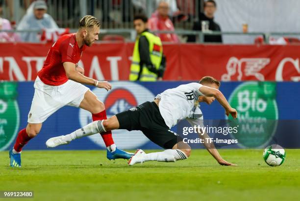 Peter Zulj of Austria and Joshua Kimmich of Germany battle for the ball during the international friendly match between Austria and Germany at...