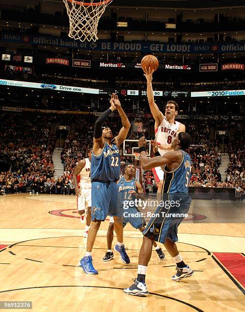 Jose Calderon of the Toronto Raptors drives the lane with a layup over Josh Howard of the Washington Wizards during a game on February 20, 2010 at...