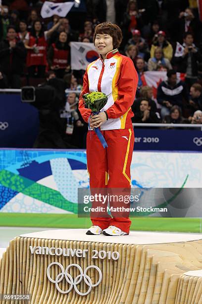Zhou Yang of China celebrates winning the gold medal during the flower ceremony for the women's 1500 m short track on day 9 of the Vancouver 2010...