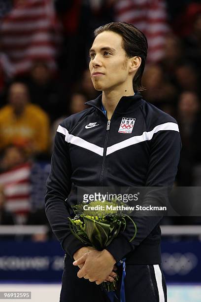 Apolo Anton Ohno of the United States reacts to winning the bronze medal during the flower ceremony for the men's 1000 m short track on day 9 of the...