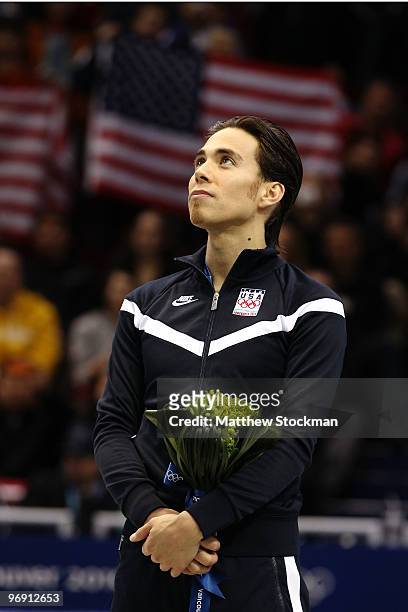 Apolo Anton Ohno of the United States reacts to winning the bronze medal during the flower ceremony for the men's 1000 m short track on day 9 of the...
