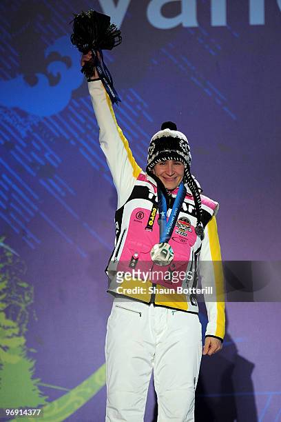 Kerstin Szymkowiak of Germany receives the silver medal during the medal ceremony for the women's skeleton held at the Whistler Medals Plaza on day 9...