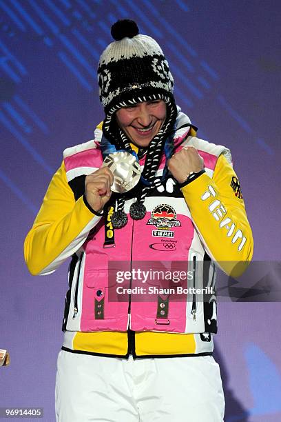 Kerstin Szymkowiak of Germany receives the silver medal during the medal ceremony for the women's skeleton held at the Whistler Medals Plaza on day 9...